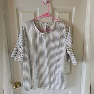 A striped blouse black and white with a keyhole in the back and bell sleeves